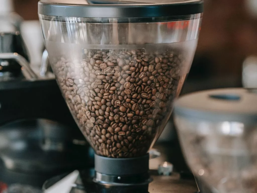 Cafe Coffee Beans in Grinder